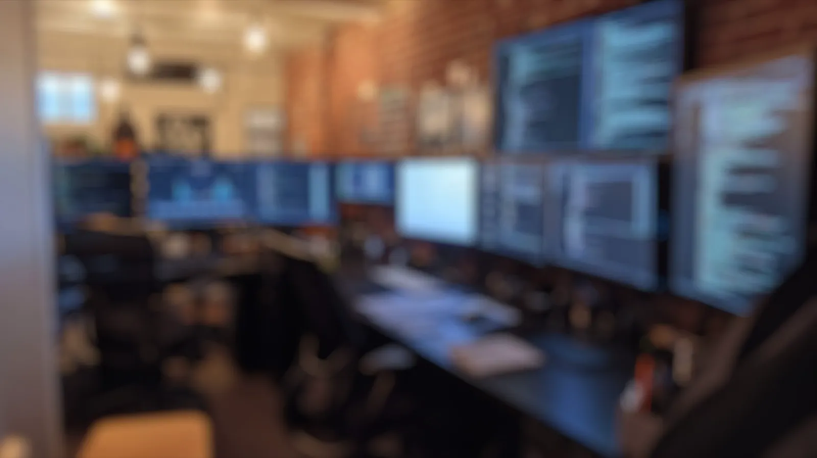 An operations room with rows of monitoring screens